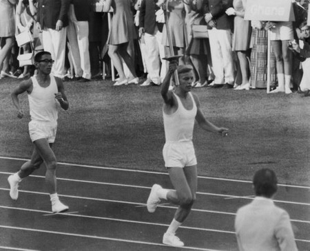 German runner Gunter Zahn arrives at the Olympic stadium in Munich, carrying the Olympic flame for the opening ceremony, on August 27, 1972.