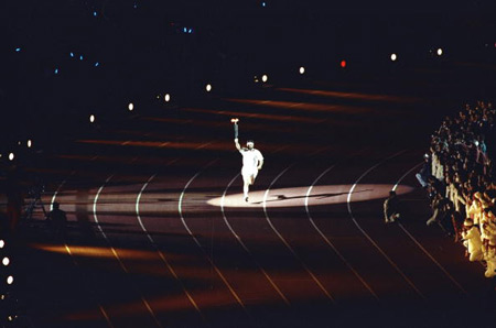 Herminio Menendez Rodrigo of Spain carries the torch around the track of the Olympic Stadium during the opening ceremony of the 1992 Olympic Games in Barcelona, Spain.