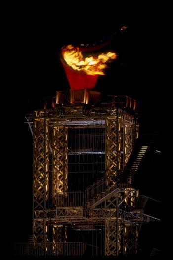 The Olympic Flame burns above the Olympic Stadium during the opening ceremony of the 1996 Olympic Games in Atlanta, Georgia.