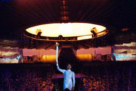 Cathy Freeman of Australia lights the Olympic Flame during the opening ceremony of the Sydney 2000 Olympic Games at the Olympic Stadium in Homebush Bay, Sydney, Australia.
