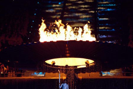 The Cauldron containing the Olympic Flame rises above torchbearer Cathy Freeman of Australia during the opening ceremony of the Sydney 2000 Olympic Games at the Olympic Stadium in Homebush Bay, Sydney, Australia.