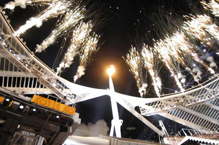 The Olympic Flame burns above the Athens Olympic Stadium during the opening ceremony of the Athens 2004 Olympic Games in Athens,Greece.