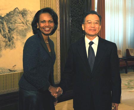 Chinese Premier Wen Jiabao (R) shakes hands with U.S. Secretary of State Condoleezza Rice in Beijing, capital of China, Feb. 26, 2008.