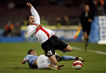 Inter Milan's Christian Chivu is tackled by Napoli's Emanuele Blasi (bottom) during their Italian Serie A soccer match at the San Paolo stadium in Naples March 2, 2008.