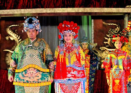 Models of China's ethnic groups present their traditional costumes during the 7th Doha Culture Festival in Doha, Qatar, March 1, 2008.