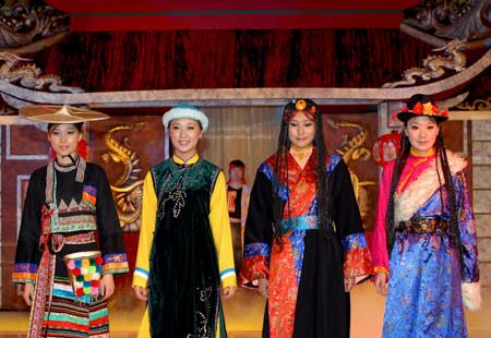Models of China's ethnic groups present their traditional costumes during the 7th Doha Culture Festival in Doha, Qatar, March 1, 2008.