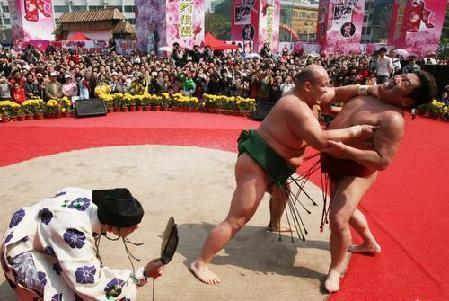 Sumo wrestlers from Japan perform at Guangzhou Sculpture Park on Sunday, March 2, 2008.