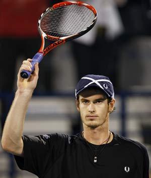 Britain&apos;s Andy Murray waves after beating Roger Federer of Switzerland in their ATP tennis match at the Dubai Tennis Championships in the Gulf emirate. Murray won 6-7 (6/8), 6-3, 6-4.