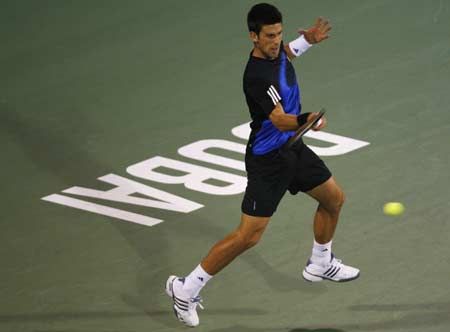 Serbia's Novak Djokovic returns the ball to Croatia's Marin Cilic during their match at the ATP Dubai Tennis Championships March 4, 2008.