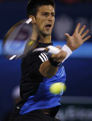 Serbia's Novak Djokovic returns the ball to Croatia's Marin Cilic during their match at the ATP Dubai Tennis Championships, March 4, 2008.