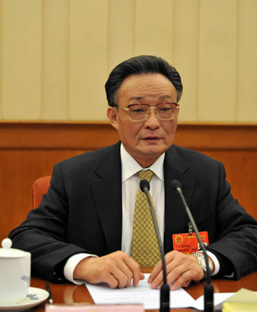 Wu Bangguo, executive chairman of the presidium of the First Session of the 11th National People's Congress (NPC), presides over the presidium's first meeting at the Great Hall of the People in Beijing, capital of China, March 4, 2008. (Xinhua/Fan Rujun)