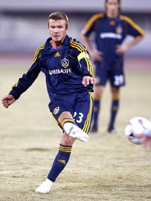 David Beckham of the Los Angeles Galaxy adjusts his shorts while