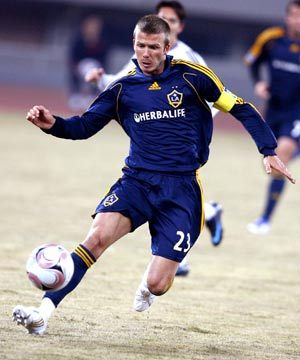 Los Angeles Galaxy's David Beckham fights for the ball during a soccer match performance against Shanghai Hong Kong United in Shanghai, east China, March 5, 2008. Los Angeles Galaxy won 3-0. 