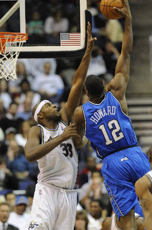 Orlando Magic's Dwight Howard (12) scores on Washington Wizards in the second half of an NBA basketball game, Wednesday, March 5, 2008 in Washington. Magic won 122-92.