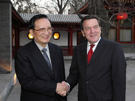 Chinese State Councilor Tang Jiaxuan (L) meets with former Chancellor of Germany Gerhard Schroeder in Beijing, capital of China, March 5, 2008.