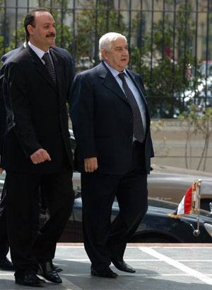 Syria's Foreign Minister Walid al-Mouallem (R) arrives at the headquarters of the Arab League in Cairo, Egypt, on March 5, 2008. 