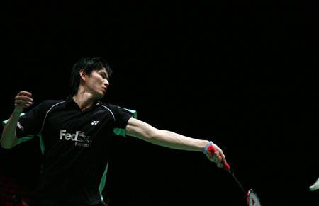 Chinse badminton player Bao Chunlai returns a shot against Chen Yu during their men's singles match of the All-England Open badminton championships in Birmingham, Britain on March 6, 2008. Bao won by 2-1.