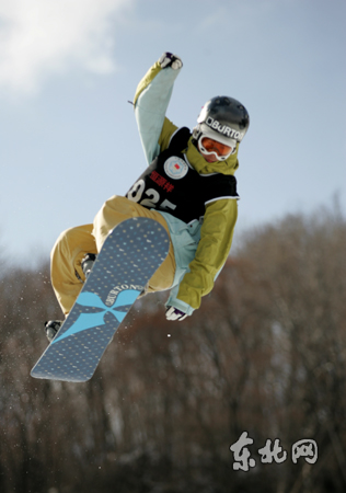 A skier competes in the 2007-2008 National Snowboard Halfpipe Championship at the Harbin Institute of Physical Education ski resort in northern China's Heilongjiang Province on Thursday, March 6, 2008.
