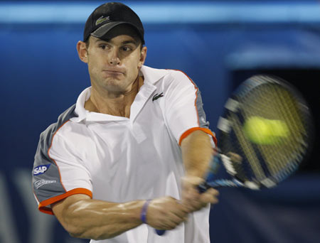 Andy Roddick of the U.S. returns the ball to Spain's Rafael Nadal during their quarter-final match at the ATP Dubai Tennis Championships March 6, 2008.