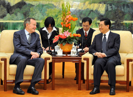 Chinese President Hu Jintao (R front) meets with former U.S. President George Bush in Beijing, capital of China, March 7, 2008. (Xinhua/Fan Rujun)