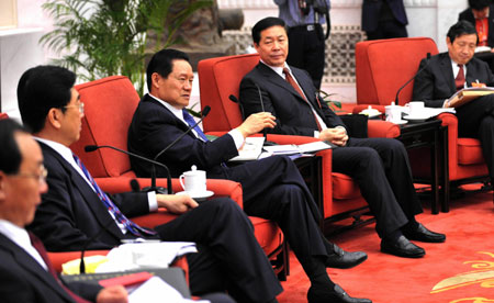 Zhou Yongkang (C), member of the Standing Committee of the Political Bureau of the Communist Party of China (CPC) Central Committee, meets with deputies to the First Session of the 11th National People's Congress (NPC) from north China's Shanxi Povince in Beijing, China, March 8, 2008. Zhou Yongkang joined in the panel discussion of Shanxi delegation on Saturday during the First Session of the 11th NPC. 
