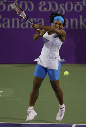 Serena Williams of the U.S returns the ball to Switzerland's Patty Schnyder during their final match at the WTA Bangalore Open tennis tournament March 9, 2008.