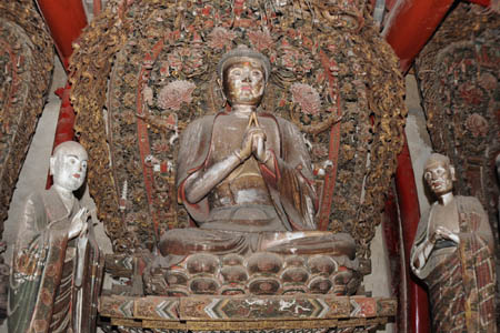 Photo taken on March 7, 2008 shows a part of the earth sculptures in Shuilu Buddhist Nunnery at the foot of Mountain Wangshun in Lantian county of northwest China's Shaanxi Province. Shuilu Buddhist Nunnery, one of key historical relics under state protection, possesses in the main hall a fine collection of over 3,000 pieces of earth mural sculptures that can be traced back to more than 1,000 years. 