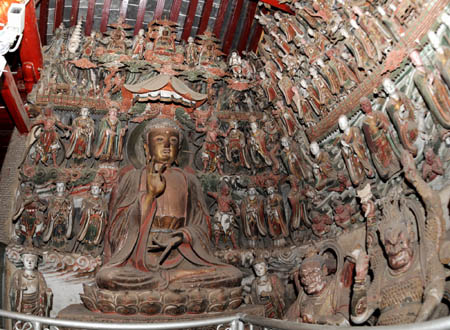 Photo taken on March 7, 2008 shows a part of the earth sculptures in Shuilu Buddhist Nunnery at the foot of Mountain Wangshun in Lantian county of northwest China's Shaanxi Province. Shuilu Buddhist Nunnery, one of key historical relics under state protection, possesses in the main hall a fine collection of over 3,000 pieces of earth mural sculptures that can be traced back to more than 1,000 years.