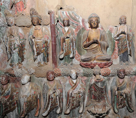 Photo taken on March 7, 2008 shows the detail of an earth sculpture in Shuilu Buddhist Nunnery at the foot of Mountain Wangshun in Lantian county of northwest China's Shaanxi Province. Shuilu Buddhist Nunnery, one of key historical relics under state protection, possesses in the main hall a fine collection of over 3,000 pieces of earth mural sculptures that can be traced back to more than 1,000 years. 