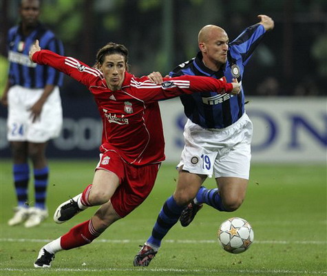 Inter Milan's Esteban Cambiasso, right, vies with Liverpool's Fernando Torres during their Champions League round of 16 second leg soccer match at the San Siro, Milan, Italy, yesterday.