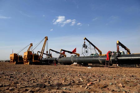 Photo taken on March 10, 2008 shows the construction site of the second project of west-to-east natural gas transmission pipeline in Fengle Town of Wuwei City, northwest China's Gansu Province. The pipeline will carry natural gas from Turkmenistan and China's Xinjiang Uygur Autonomous Region to the central and west China’s areas as well as the Yangtze and Pearl River deltas. The 9,102-kilometer pipeline that is under construction consists of a main line and eight sub-lines traversing 14 provinces, autonomous regions and the municipality Shanghai. The pipeline’s designed gas transmission capacity is 30 billion cubic meters annually. The total investment on the project is 142.2 billion yuan (about 20 billion U.S. dollars) 