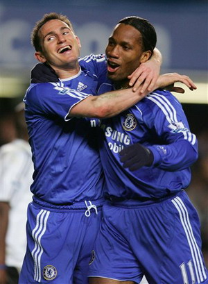 Chelsea's Frank Lampard, left, celebrates reacts after his fourth goal against Derby County with Didier Drogba during their English Premier League soccer match at the Stamford Bridge Stadium, London, yesterday.