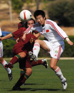 China's Bi Yan (R) competes in a match against Portugal in the Algarve Cup women's soccer championship in Algarve, Portugal, March 12, 2008. China won 6-5 and placed the ninth.