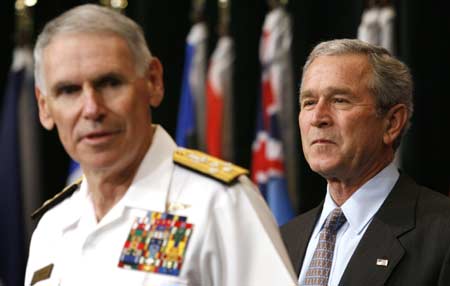 U.S. President George W. Bush is introduced by William J. Fallon (L), Commander of Centcom, after a briefing on the war in Iraq during a visit to Centcom in Tampa, Florida, May 1, 2007. 
