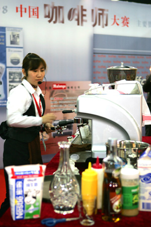 A girl operates as she takes part in a coffee making contest during the 14th China International Exhibition for Hotel & Restaurant Facilities, Equipment & Services, Food & Beverages that opened at the China World Trade Center Exhibition Hall in Beijing, capital of China, on March 16, 2008.