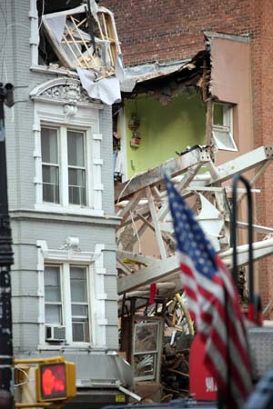 A crane is collapsed atop a building in New York on March 15, 2008. 