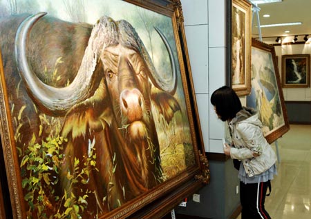A visitor looks at a painting at the painting exhibition of artists from the Democratic People's Republic of Korea (DPRK) held in Dalian, a coastal city in northeast China's Liaoning province, March 16, 2008.