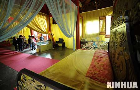 Visitors visit the bedroom in the Xiyue Temple which is located at the foot of the Huashan mountains in northwest China's Shaanxi province, March 15, 2008. 