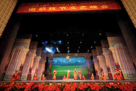 Perfomers perform acrobatics during the party held in Xinjiang opera house to welcome the Noruz Festival in Urumqi, Xinjiang Uygur Autonomous Region, March 17, 2008. (Xinhua Photo)