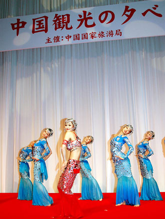 Chinese artists perform a traditional dance to promote 'Visit China in Olympic Year', in Tokyo, Japan, March 17, 2008.