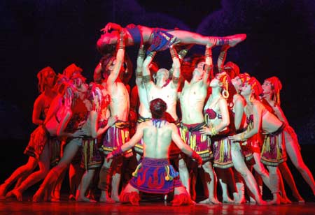 Dancers perform Chu Shui Ba Shan, an original drama displays a panorama of ancient people at the Three Gorges area of China, during a public show in Yichang City, central China's Hubei province, March 17, 2008. Chu Shui Ba Shan is created and performed by the Yichang Song and Dance Ensemble. The drama has been condensed and put into the tourism market as a culture product, into which bilingual host has been added, to meet the market needs. (Xinhua Photo)