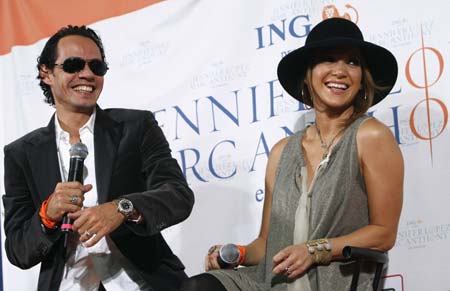 Jennifer Lopez and Marc Anthony laugh with students as they announce their En Concierto kickoff tour at Bronx PS 36 grade school in New York Sept. 25, 2007. Lopez gave birth to twins, a boy and a girl, early Friday in Long Island, New York, People magazine reported. 