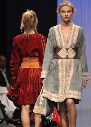 Models present creations by Saudi Arabian designer Amina Al Jassim during the Abu Dhabi Fashion Week at Emirates Palace March 18, 2008.