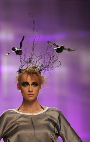 A model presents a creation by designer Artem Klimchuk during fashion week in Kiev March 18, 2008. Picture taken March 18, 2008. 