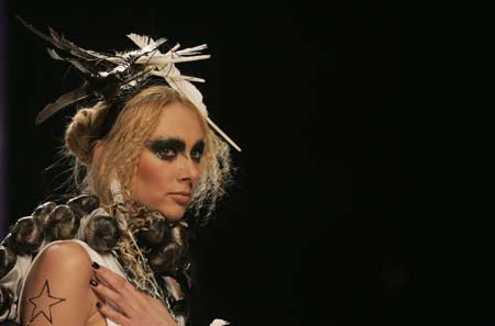 A model presents a creation by designer Artem Klimchuk during fashion week in Kiev March 18, 2008. Picture taken March 18, 2008. 