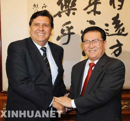 Top Chinese legislator Wu Bangguo and Chinese Premier Wen Jiabao held separate meetings here on Thursday with Peruvian President Alan Garcia, vowing to further bilateral cooperation.