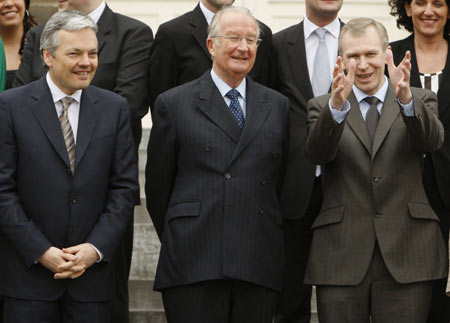 Nine months after the general elections, Belgium's new government was finally sworn-in Thursday with Flemish Christian Democrat Yves Leterme appointed as the country's new prime minister.