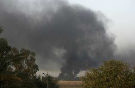 Smoke rises from central Baghdad's Green Zone after a rocket attack March 23, 2008.