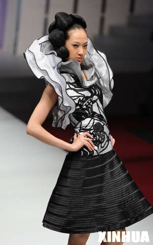A model presents a creation during the first day of 2008/2009 China Fashion Week (A/W) Collections in Beijing, capital of China, March 25, 2008.