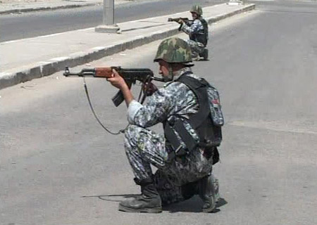 Iraqi troops take up positions in Basra in this television grab March 25, 2008.